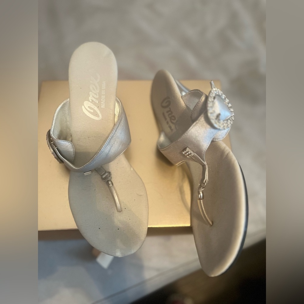 Silver sandal with rhinestone buckle and accent on the thong  size 8